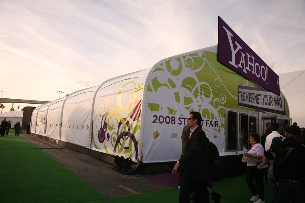 Visitors walking past a large white Yahoo! show tent set up across from the Las Vegas Convention Center during CES 2008