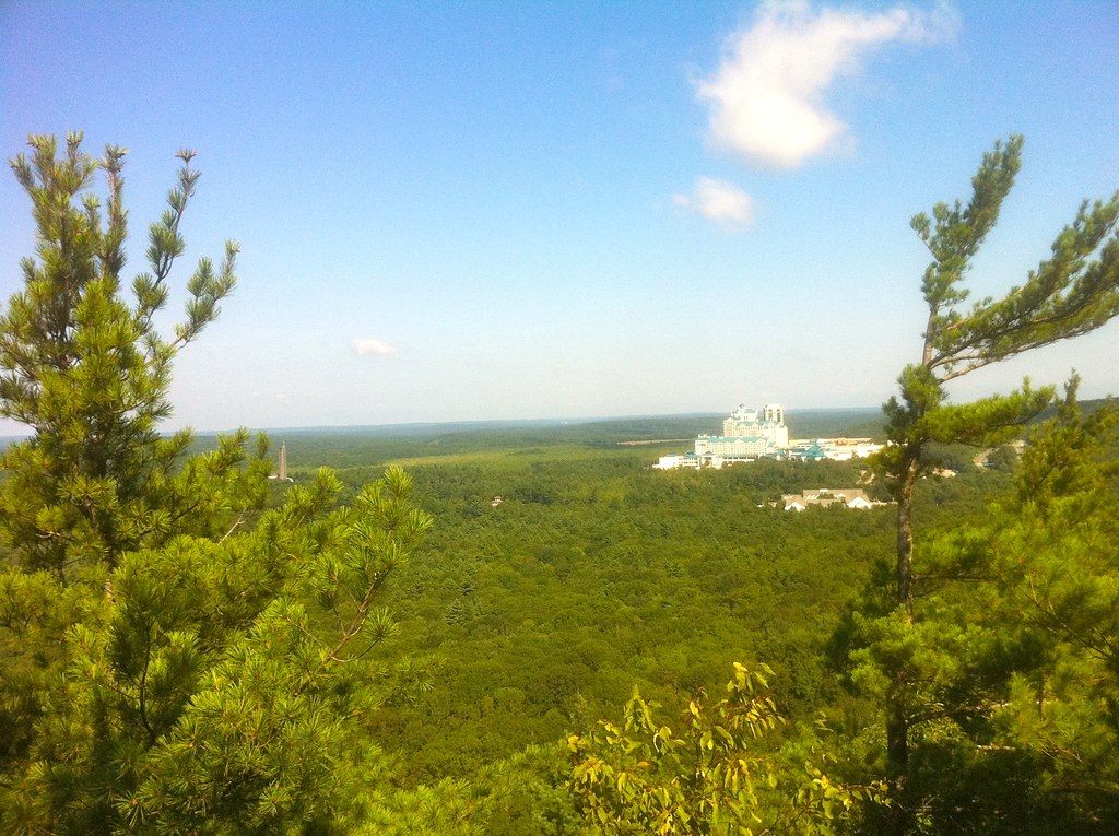 View from Lantern Hill on the Narragansett Trail over forest to the Mashantucket Pequot casino resort