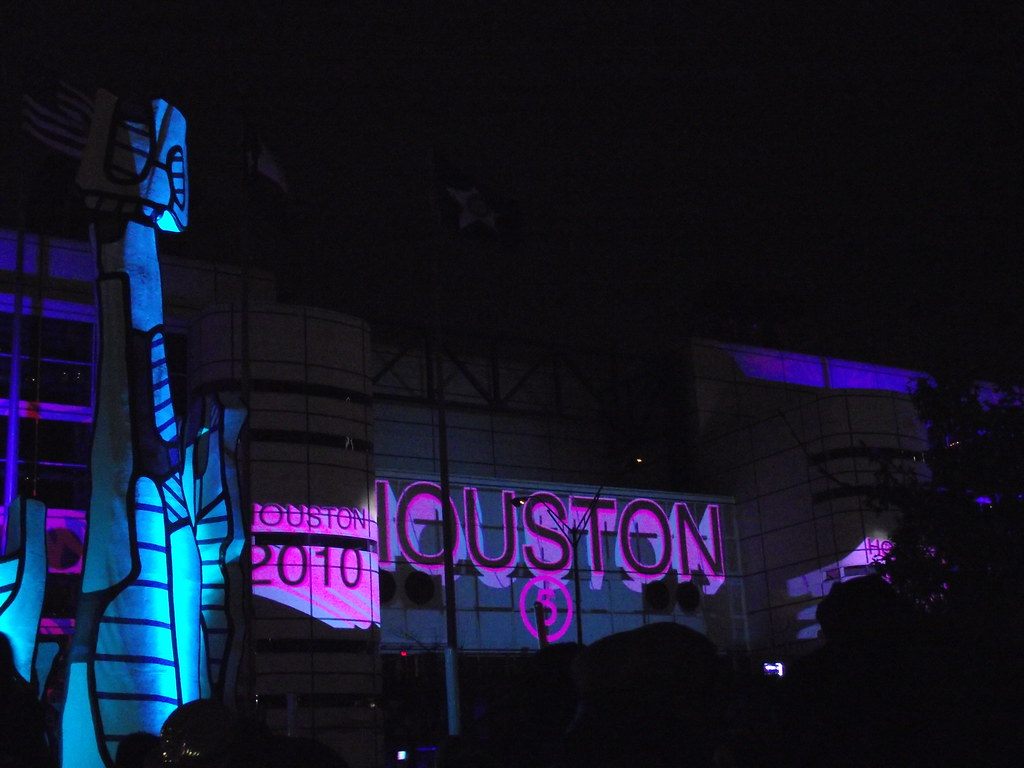 Houston 2010 projected in pink light on the George R. Brown Convention Center at night for a New Year's countdown