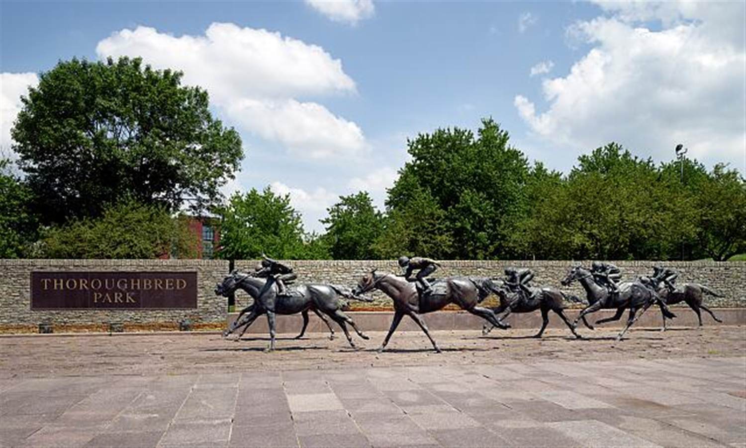 Bronze thoroughbred horse racing sculptures in Thoroughbred Park, downtown Lexington, Kentucky