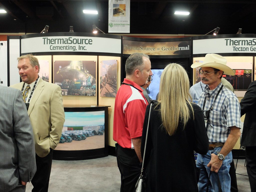 Exhibitors and visitors in conversation at the ThermaSource booth during the GEA Geothermal Expo 2013 opening reception in Las Vegas