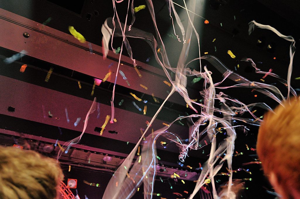 Streamers and confetti rain down over fans' heads beneath the lighting rig at the Poughkeepsie Civic Center