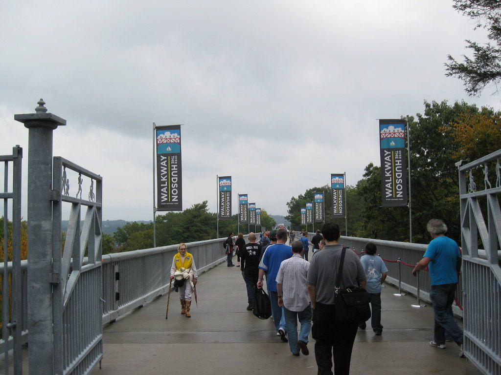 Visitors stream onto the Walkway Over the Hudson beneath rows of Walkway banners in Poughkeepsie, October 2009