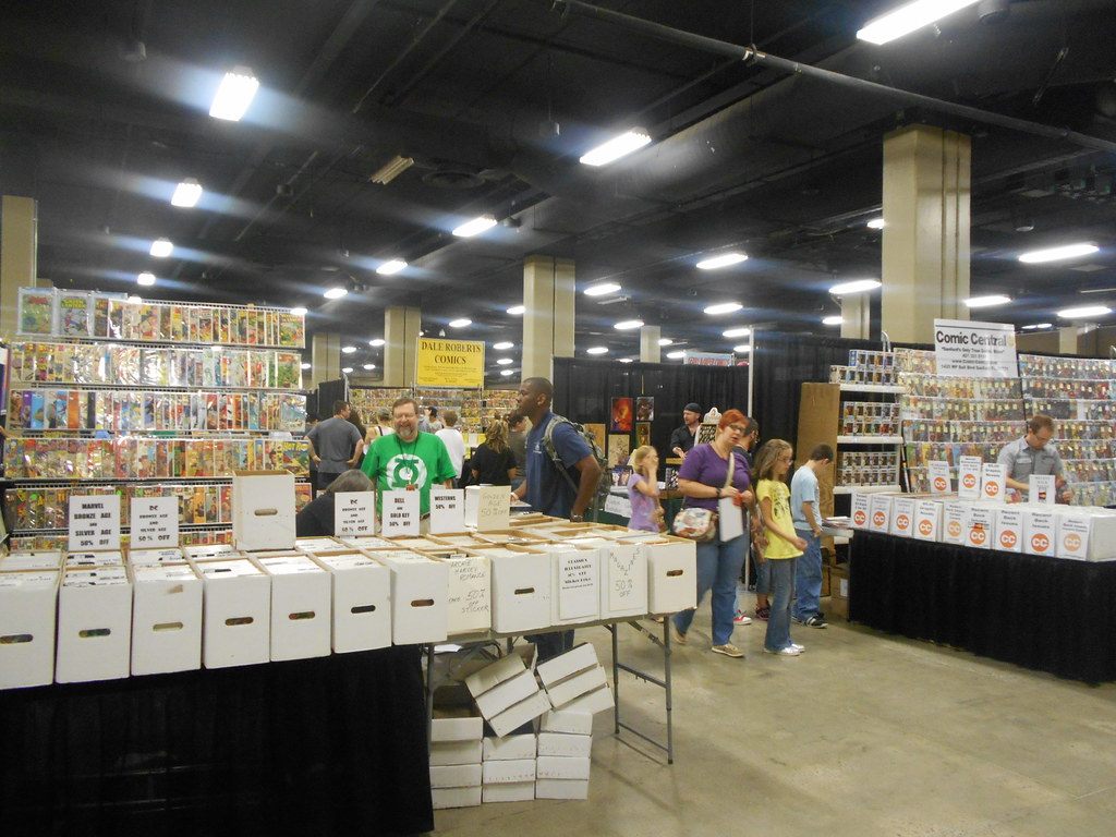 Shoppers browse long rows of comic-book dealer tables in an Opryland exhibit hall during a Nashville comic convention