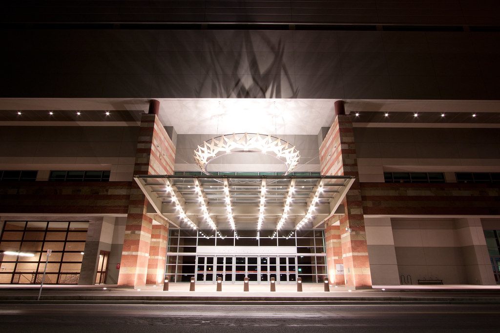 The lit glass entrance and canopy of the Phoenix Convention Center North Ballroom at night