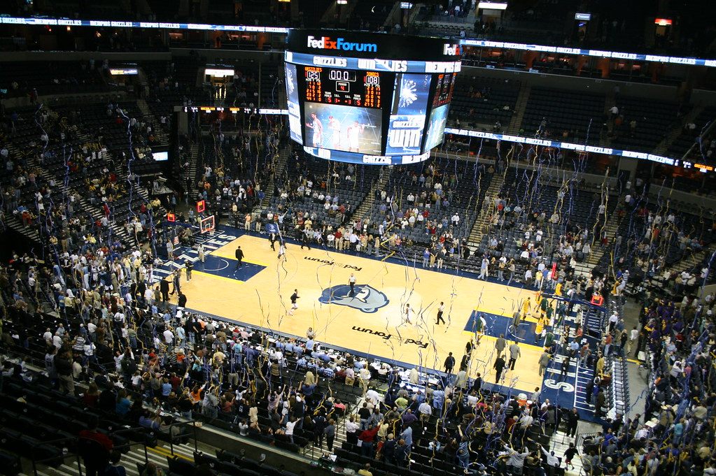 A packed FedExForum crowd under the center-hung scoreboard as streamers fall over the court at a Memphis Grizzlies game