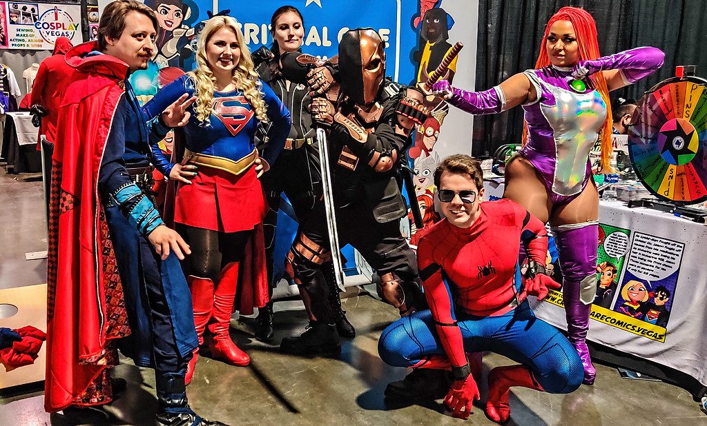 Cosplayers dressed as Doctor Strange, Supergirl, Spider-Man, Starfire and Deathstroke pose at LVL Up Expo 2022 in the Las Vegas Convention Center