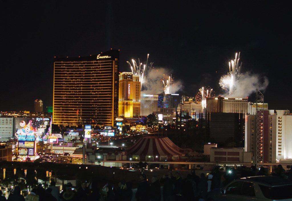 Spectators watch New Year's fireworks burst over Encore, the Palazzo and the Venetian on the north Las Vegas Strip, January 2013