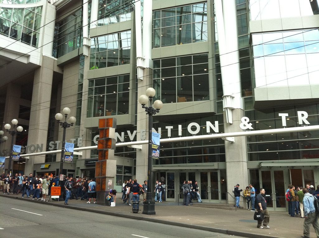 PAX 2010 attendees lining the sidewalk outside the Washington State Convention Center entrance