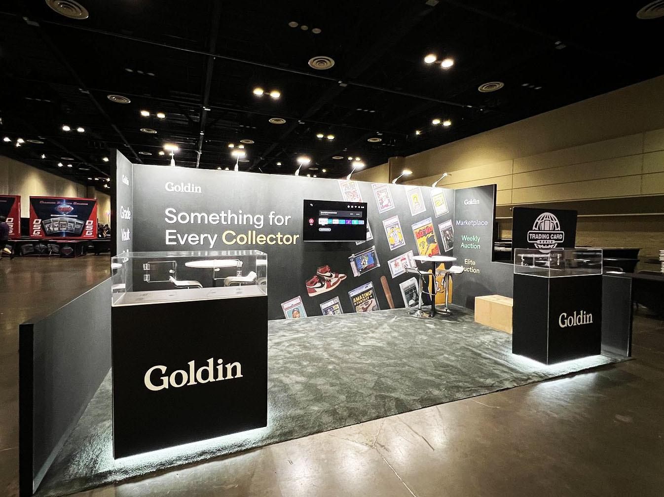 Design render of a 10×20 inline trade show booth: inline booth with dark printed wall and lit display cases