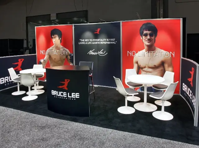 10×20 Inline Booth With Large Portrait Graphics and Two Meeting Tables