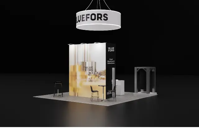 20×20 Island Booth With Round Hanging Sign and Tall Graphic Tower