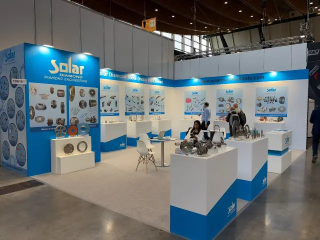 20×30 Corner Booth With Tall Logo Tower and Pedestal Displays