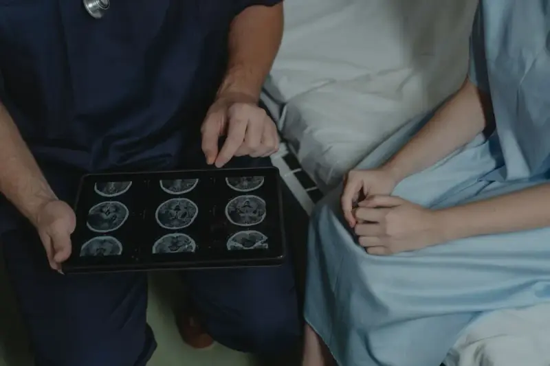 Professional reviewing brain scan images