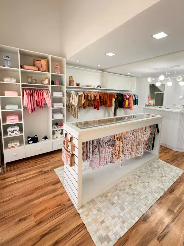 Children's boutique with clothing racks and coordinated retail shelving