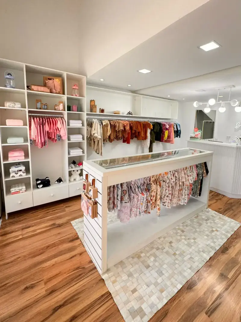 Children's boutique with clothing racks and coordinated retail shelving