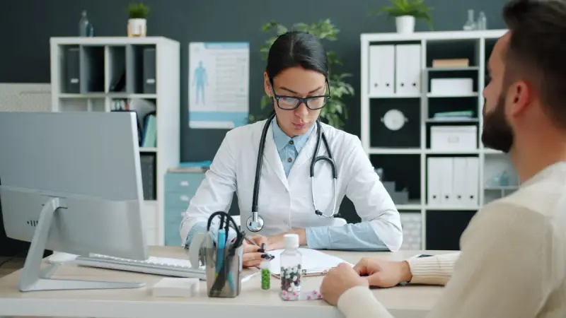 Female doctor consulting a participant in a modern office
