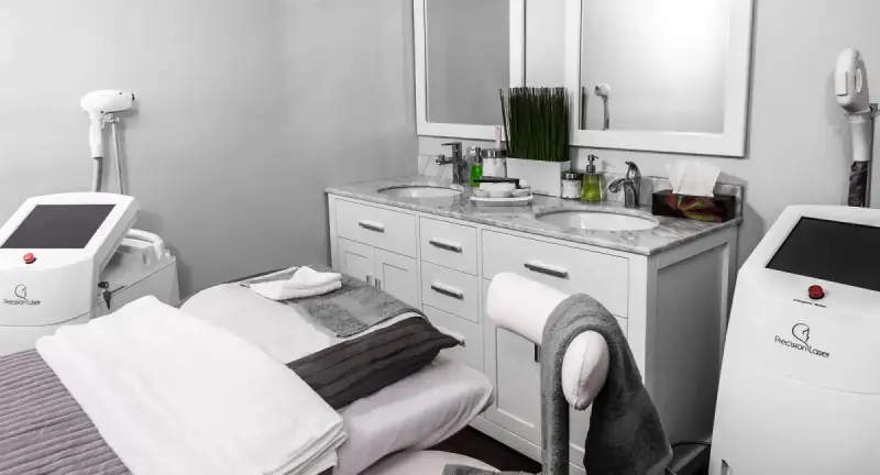 Aesthetic clinic room with treatment furniture and equipment