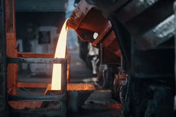 Molten metal being poured in a foundry.