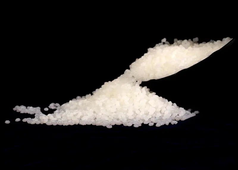 Close view of polypropylene resin pellets used as raw material for plastics processing