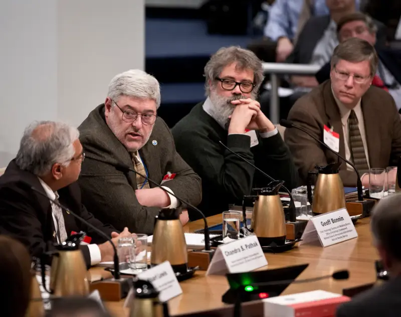 Panel of nuclear specialists speaking at a technical briefing table