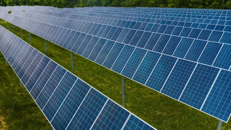 Aerial view of a solar power station in green countryside