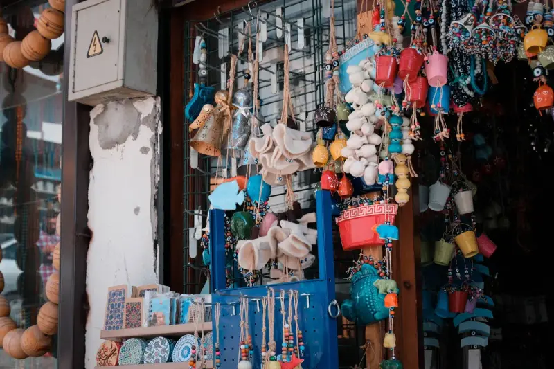 Doorway hung with handmade ornaments, ceramic charms and colorful souvenirs