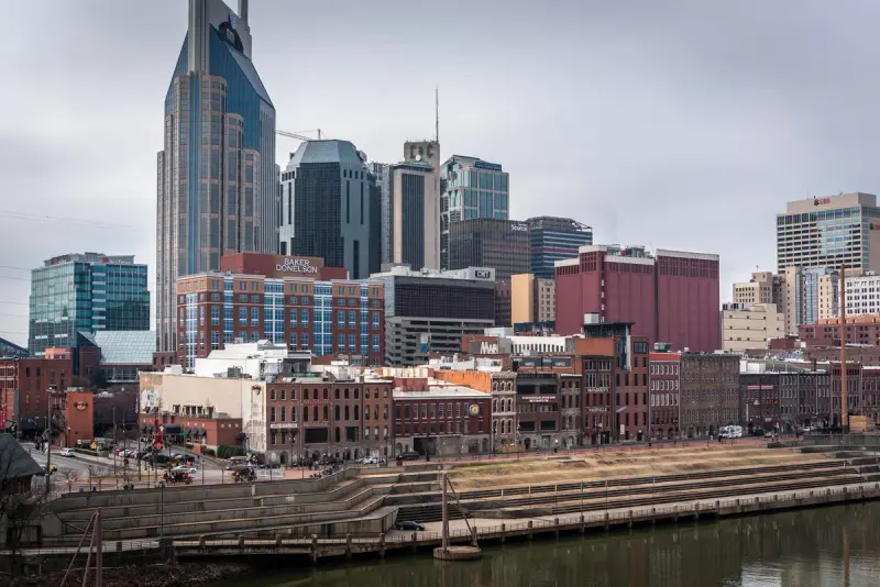 Downtown Nashville skyline with brick buildings along the Cumberland River