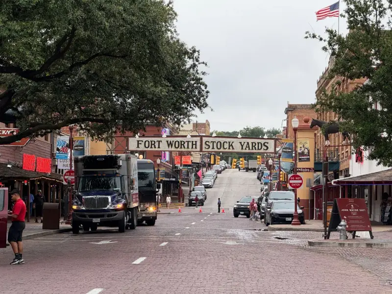 Main street of the historic Fort Worth Stockyards with its arched sign and brick storefronts
