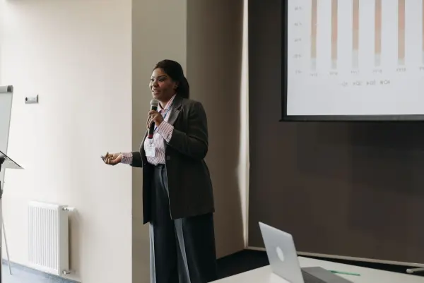 Businesswoman presenting ideas to an audience at a professional meeting