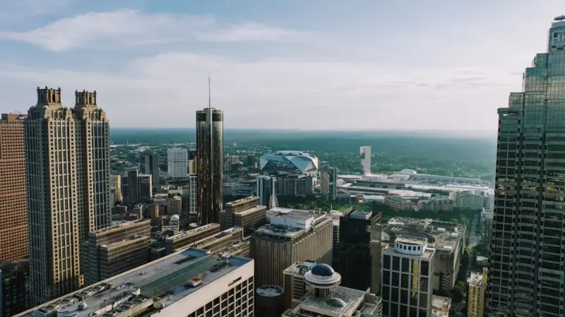 Aerial view of Atlanta's high-rise skyline stretching to the horizon on a clear day