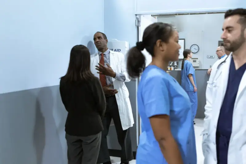 Healthcare professionals having a discussion in a medical setting.