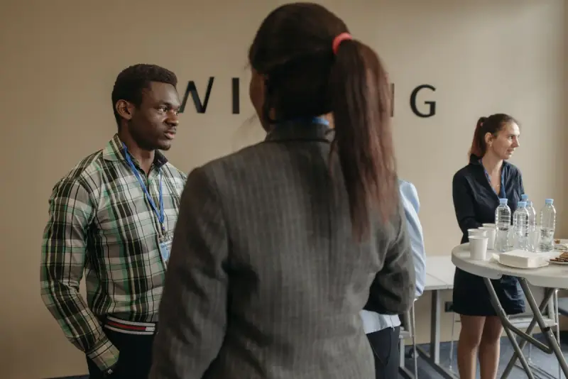 Professionals networking at an indoor seminar