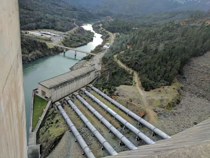 Five large penstocks running down the face of Shasta Dam to the powerhouse