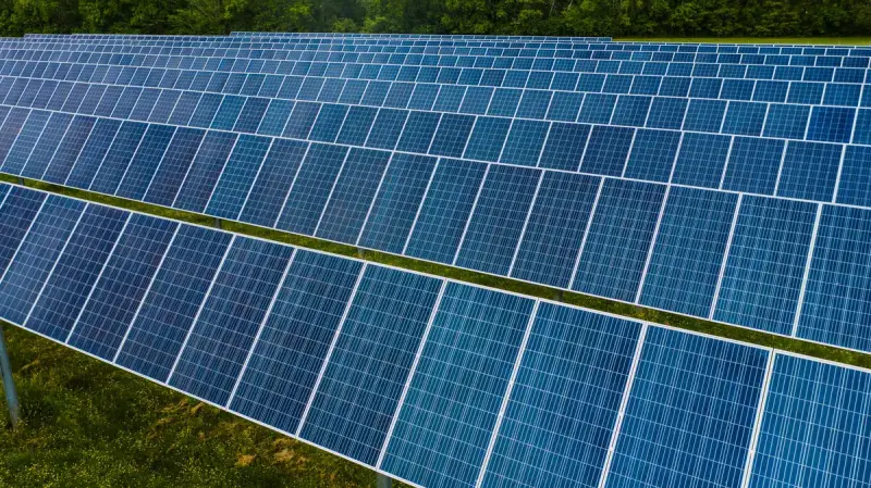 Rows of photovoltaic panels at a large solar power station