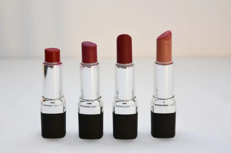 Four lipsticks in different shades lined up side by side