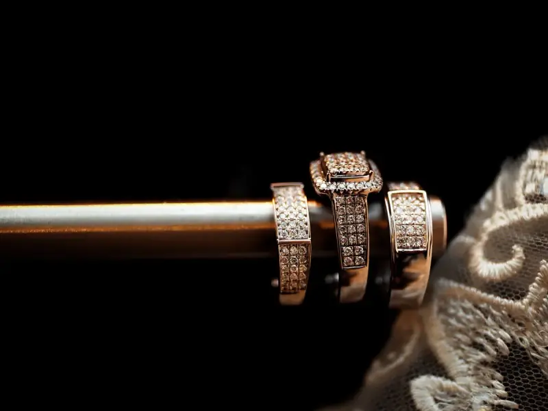 Diamond wedding rings arranged with delicate lace behind them