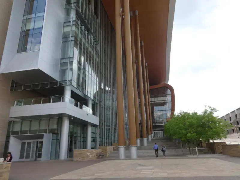 Music City Center entrance plaza with tall wood-clad columns under a sweeping roof