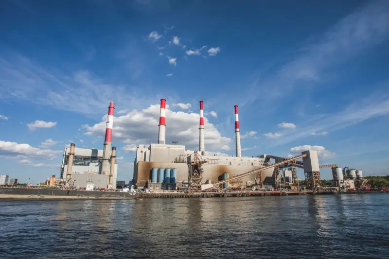 Ravenswood Generating Station with striped stacks on the New York City waterfront