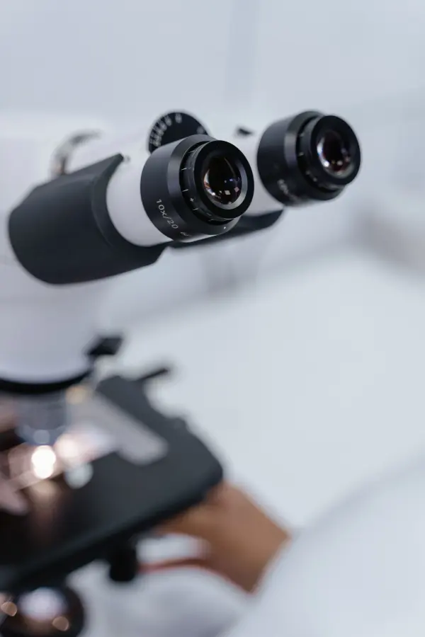 Close view of microscope objective lenses in a laboratory