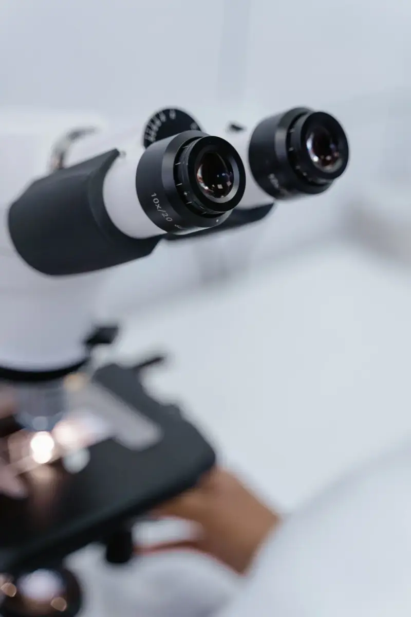 Close view of microscope objective lenses in a laboratory