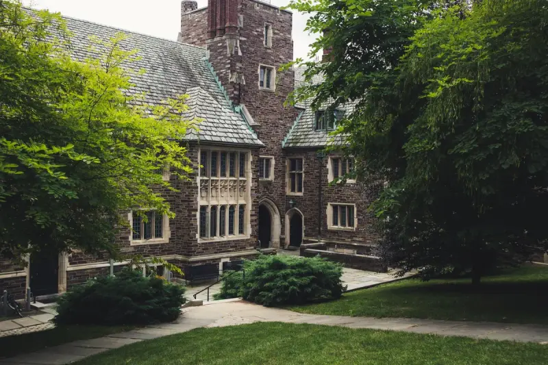 Gothic stone building and lawn on the Princeton University campus in summer