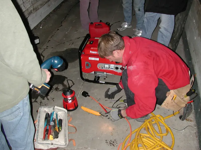 Electrician connecting a generator to a home's electrical panel