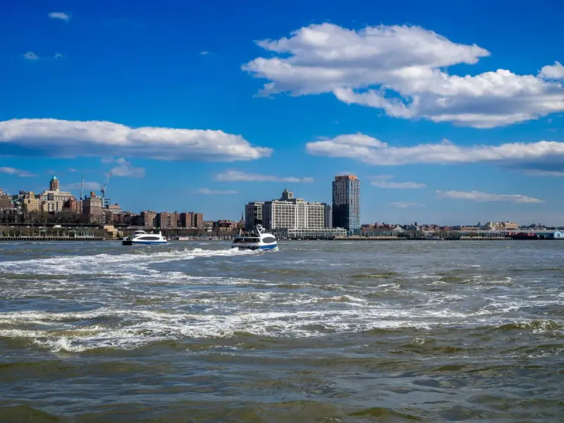 Boats on the Hudson River with the New York City skyline behind