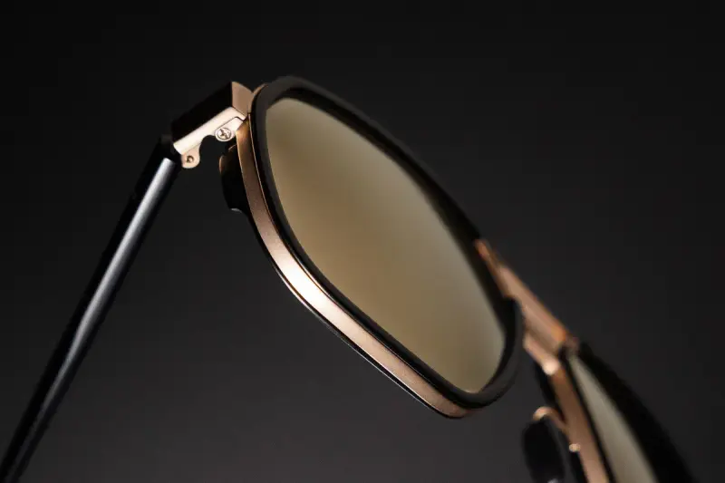Modern sunglasses with a sleek metallic frame, close up