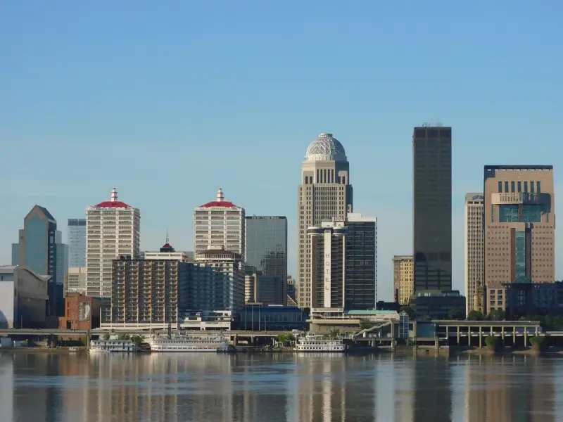 Downtown Louisville skyline with towers reflected in the Ohio River