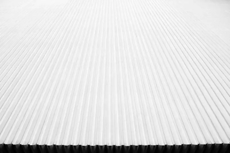 Close detail of white corrugated metal roofing.