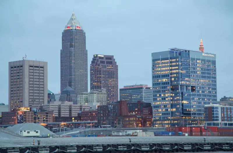 Downtown Cleveland skyline with lit office towers in the evening