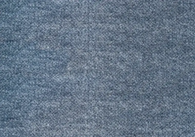 Close-up of a textured blue fabric surface