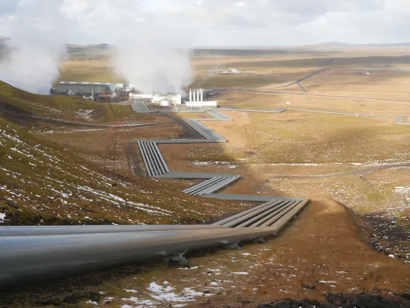 Large geothermal power station with steam plumes on a volcanic plateau